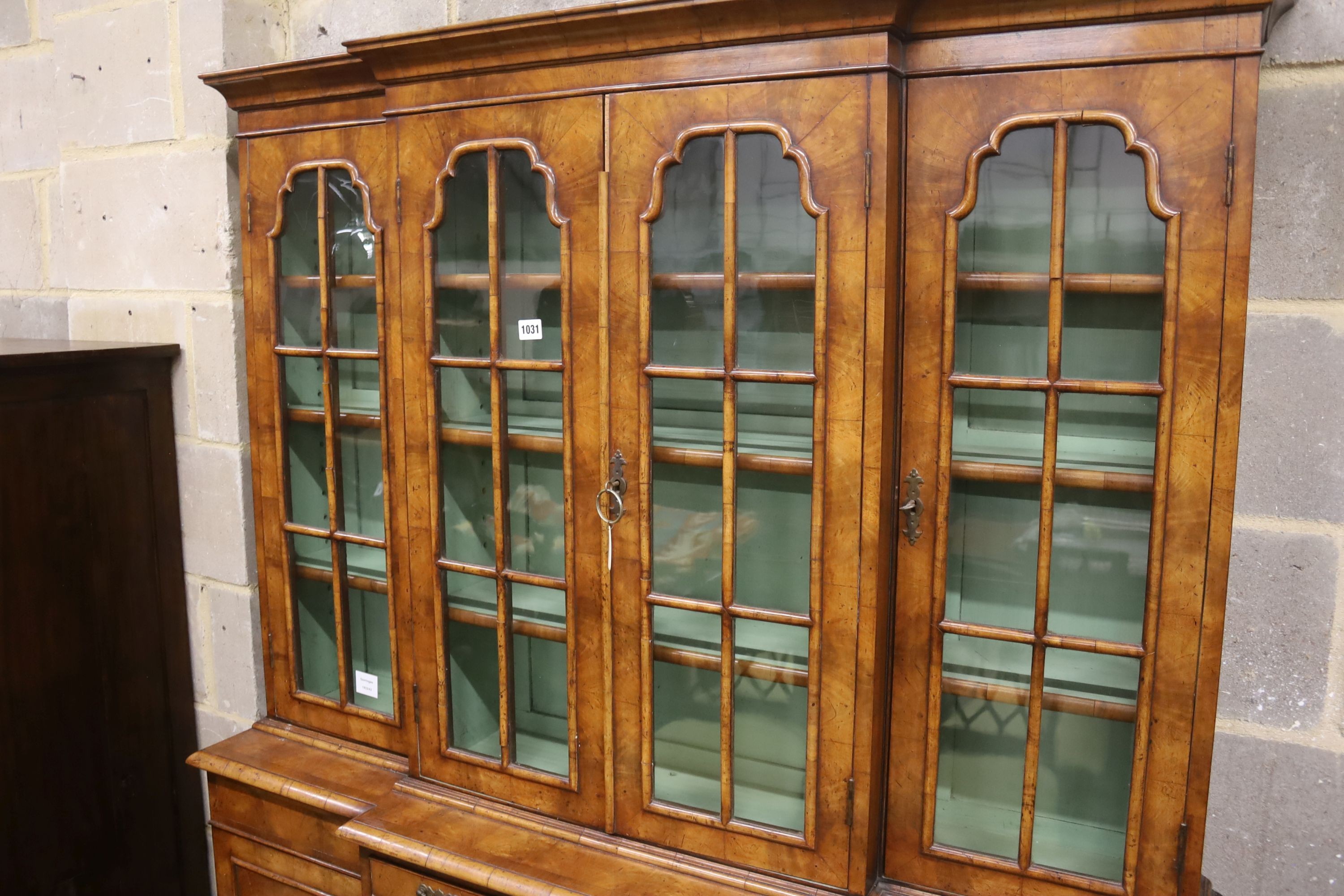 A small Queen Anne revival walnut breakfront library bookcase, length 132cm, depth 34cm, height 190cm